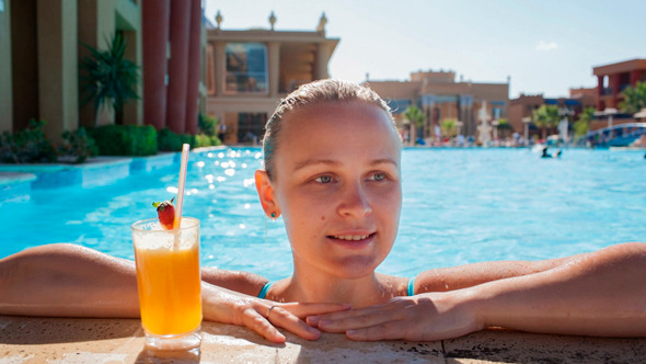 Woman In The Pool With Juice And Splashing Feet Stock Footage Videohive